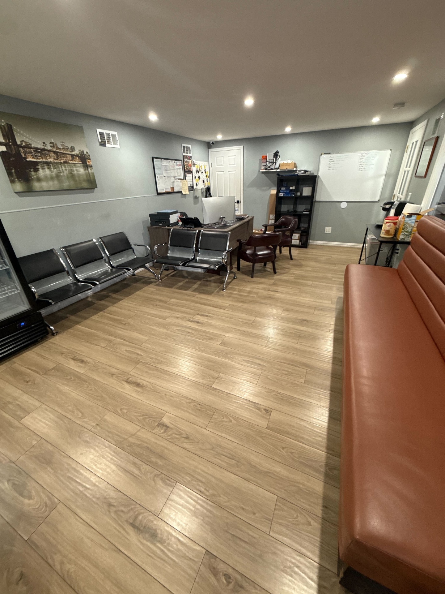 Total Auto Services clean customer waiting lobby with seating and front desk