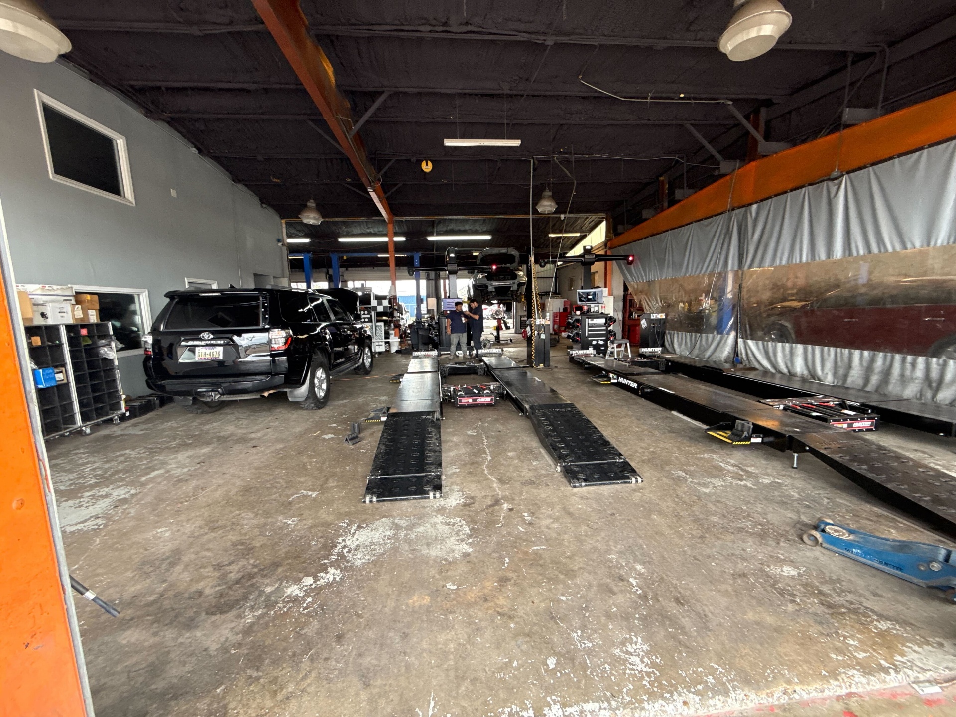 Total Auto Services alignment bay with Hunter alignment rack and lifted Toyota 4Runner